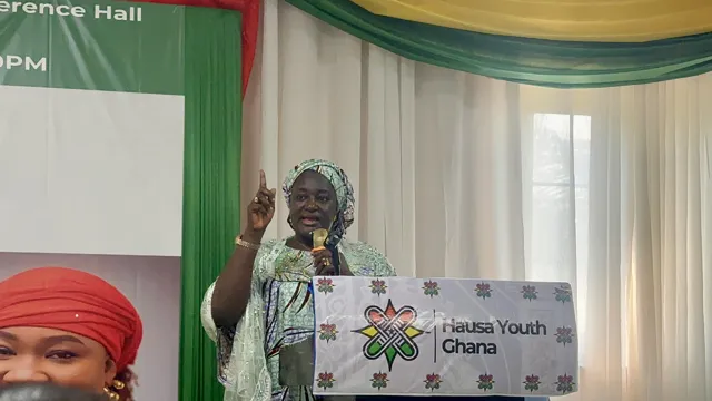 Addressing the audience at a youth event